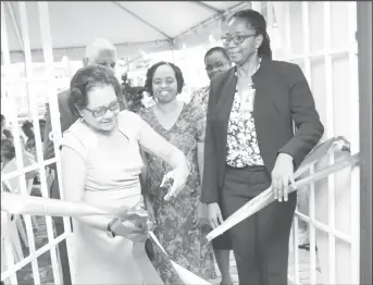  ??  ?? First Lady Sandra Granger cuts the ribbon to the Mercy Resident Care Home, in the official commission­ing of the building.