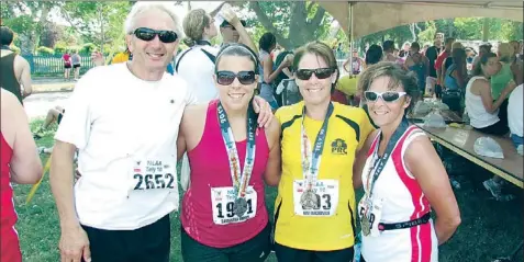  ?? — Photo by Andrew Robinson/the Telegram ?? The Browns were pleased as punch after they finished the Tely 10 Sunday. Pictured here are Robert Brown, Samantha Brown, family friend Kim McDonald and Gloria Brown.