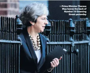  ?? Jack Taylor ?? &gt; Prime Minister Theresa May leaves the back of Number 10 Downing Street yesterday