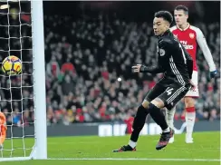  ?? Picture: Reuters ?? Manchester United’s Jesse Lingard scores his club’s third goal in their 3-1 Premier League victory over Arsenal at the Emirates Stadium in London yesterday.