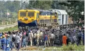  ?? — PTI ?? Security on high alert as the first train passes by before resumption of railway services since the train accident in Amritsar on Sunday.