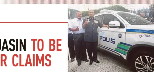  ?? PIC BY NUR ADIBAH AHMAD IZAM ?? Inspector-General of Police Tan Sri Mohamad Fuzi Harun receiving a new police vehicle from Anih Bhd executive director Datuk Nik Fauzi Nik Hussein at the launch of Op Selamat 13 in Kuala Lumpur yesterday.