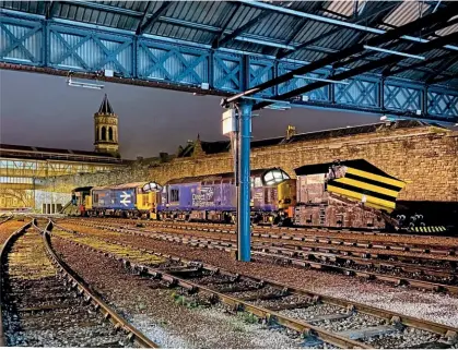  ??  ?? PERTH PLOUGHS: A rare view (taken with permission) from inside the carriage sidings shed at Perth on February 4 after DRS Type 3s Nos. 37423+37401 had arrived from Motherwell on standby to patrol the Highland Main Line with independen­t snowplough­s Nos. ADB965236 and ADB965231. Jordan Kearney