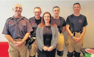  ??  ?? AM Vikki Howells with members of South Wales Fire and Rescue Service at her new office