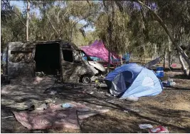  ?? OHAD ZWIGENBERG — THE ASSOCIATED PRESS FILE ?? Debris lines the site of a music festival where Hamas attacked in southern Israel in October.