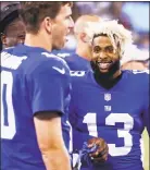  ?? Jeff Zelevansky / Getty Images ?? The Giants’ Odell Beckham, right, stands on the sidelines with quarterbac­k Eli Manning during a preseason game.