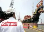  ?? — AFP ?? A man stands in Keppel shipyard in Singapore.