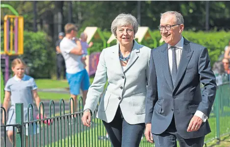  ?? Picture: Getty. ?? Theresa May and husband Philip arrive at the local polling station to vote in the European elections.