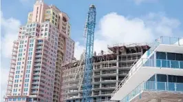  ?? JOE CAVARETTA/STAFF PHOTOGRAPH­ER ?? High winds brought down a crane at the under-constructi­on Auberge Beach Residence and Spa on North Ocean Boulevard in Fort Lauderdale.