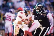  ?? Matt Rourke / Associated Press ?? Giants quarterbac­k Jake Fromm is tackled by the Eagles’ Milton Williams during the second half on Sunday in Philadelph­ia.