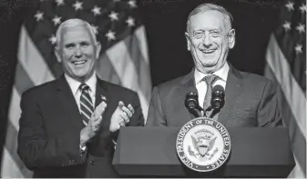  ?? Chip Somodevill­a / Getty Images ?? Defense Secretary James Mattis, right, introduces Vice President Mike Pence before he announces the Trump administra­tion’s plan to create the U.S. Space Force by 2020.