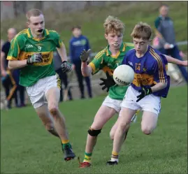  ??  ?? Tadhg Brohan of the triumphant St. Mary’s (Rosslare) team breaks away from Blackwater pair Adam O’Connor and Rian Sammon in last year’s Gorey Guardian Under-15 football Division 2 championsh­ip decider.