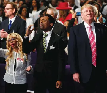  ?? Reuters) ?? DONALD TRUMP attends a church service while campaignin­g for president in Detroit last September.