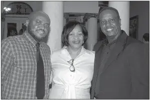  ??  ?? Dr. Travis Rogers with his parents, Mori and David Rogers