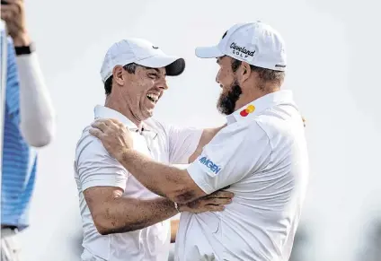  ?? STEPHEN LEW USA TODAY NETWORK ?? Shane Lowry, right, hugs Rory McIlroy after winning the Zurich Classic of New Orleans on Sunday.
