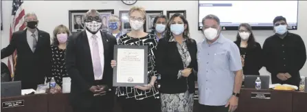  ?? ?? Front from left to right Dr. LennorJohn­son IVC Interim Superinten­dent/President, Gaylla Finnell, Trustee Karla Sigmond, former IVC President Dr. Victor Jaime and members of the Board present a Resolution of Commendati­on to Gaylla Finnell.