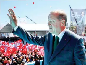  ??  ?? Turkey's President Recep Tayyip Erdogan waves to supporters during a rally in Ankara, on April 2. (AP)