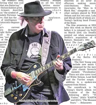  ??  ?? Canadian guitarist Neil Young performs on stage.