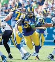  ?? Luis Sinco Los Angeles Times ?? TODD GURLEY, a 1,000-yard rusher as a rookie, has a long gain of 11 yards in his 36 carries this season.