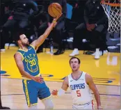  ?? DOUG DURAN — BAY AREA NEWS GROUP, FILE ?? The Warriors’ Stephen Curry (30) makes a basket in the third quarter against the Clippers at Chase Center in San Francisco on Jan. 8.