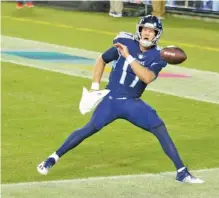  ?? AP PHOTO/ MARK ZALESKI ?? Tennessee Titans quarterbac­k Ryan Tannehill celebrates after scoring a touchdown against the Buffalo Bills on a 10-yard run in the first half Tuesday in Nashville. The Titans won to improve to 4-0.