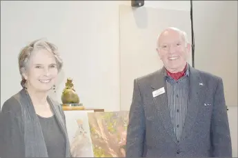  ?? Rachel Dickerson/The Weekly Vista ?? Blackwood (left) is pictured with Bella Vista Mayor Peter Christie at the Bella Vista Public Library after unveiling a bronze sculpture the city purchased and donated to the library.