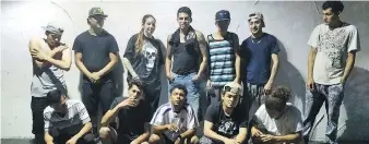  ?? U.S. ATTORNEY FOR THE EASTERN DISTRICT OF VIRGINIA. ?? Shannon Sanchez, standing third from left, with a group that includes MS-13 gang members. Some American M-13 gang chapters allow women to become members.