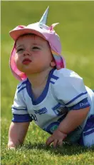  ?? SPORTSFILE DAIRE BRENNAN/ ?? One-year-old Waterford supporter Fia White, from Dungarvan, enjoys the Fraher Field pitch after the game against Monaghan