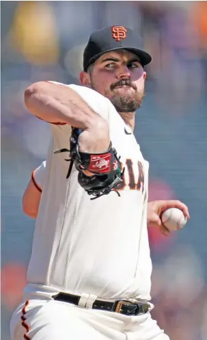  ?? AP PHOTO/GODOFREDO A. VÁSQUEZ ?? San Francisco Giants starter Carlos Rodón pitches against the Atlanta Braves on Wednesday. The host Giants won 4-1 to hand the Braves their fourth loss in five games.