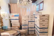  ?? UNCREDITED/HOGP, ASSOCIATED PRESS ?? This image, contained in the indictment against former President Donald Trump, shows boxes of records stored in a bathroom and shower in the Lake Room at Trump’s Mar-a-Lago estate in Palm Beach, Fla.