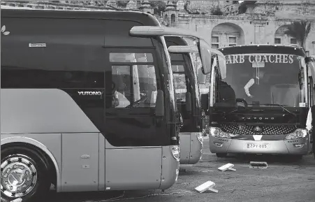  ?? XINHUA ?? Yutong electric buses are seen at a parking lot in Malta’s capital Valletta on Friday.