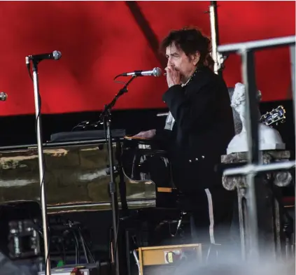  ?? (Helle Arensbak/Reuters) ?? BOB DYLAN performs on opening day at the Roskilde Festival in Denmark last year.