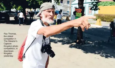  ??  ?? Roy Thomas, the oldest competitor in The Gleaner’s Capture Kingston photo competitio­n, in downtown Kingston yesterday.