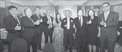 ??  ?? Former President Fidel V. Ramos (center) makes his signature hand gesture with (from left) Manila Water Foundation board member Abelardo Basilio, Philippine Foundation for Science and Technology president Filemon Berba Jr., Manila Water Foundation...