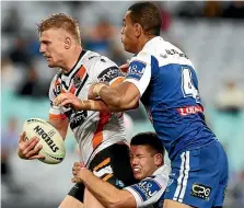  ?? GETTY IMAGES ?? Luke Garner, with ball, says rugby league is ‘‘a little bit softer’’ than in previous eras.