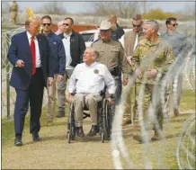  ?? AP photo ?? Republican presidenti­al candidate former President Donald Trump talks with Texas Gov. Greg Abbott during a visit to the U.S.-Mexico border on Thursday, in Eagle Pass, Texas.