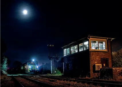  ?? CRAIG MUNDAY ?? The moon shines bright for Colas’s No. 70803 at Goonbarrow as it became the first of the class to work on the Newquay branch beyond St Blazey overnight on September 21/22, with a rail train from Westbury. It is seen awaiting the possession to be taken, with the rails due to be unloaded at Bugle and Roche.