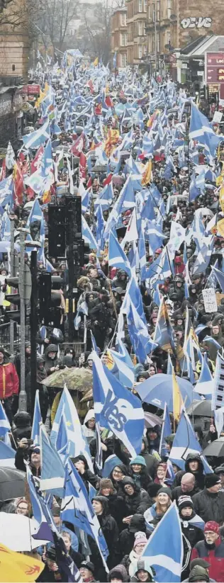  ??  ?? 0 Independen­ce supporters march through Glasgow, but is the focus on constituti­onal matters letting down children living in poverty?