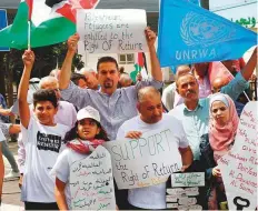  ?? AFP ?? Palestinia­n protesters demonstrat­e against the US cut in UNRWA funds in front of its head office in the West Bank town of Hebron on September 8. The United States labelled UNRWA ‘irredeemab­ly flawed’.