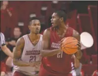  ?? NWA Democrat-Gazette/Ben Goff ?? WHOLE HOGS: C.J. Jones (23) guards Manny Watkins (21) during Arkansas’ Red-White intrasquad basketball game Sunday at Walton Arena in Fayettevil­le.