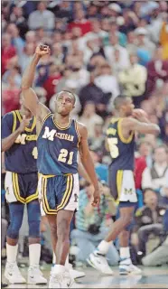  ?? AP FILE PHOTO ?? In this April 4, 1989, file photo, Michigan’s Rumeal Robinson celebrates making the first of two free throws with three seconds remaining in overtime against Seton Hall in the NCAA college basketball Final Four championsh­ip game in Seattle. Michigan defeated Seton Hall 80-79.