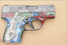  ?? Albany Police ?? Albany Mayor Kathy Sheehan, Councilmem­ber Joyce Love and Albany Police Chief Eric Hawkins met with the toddler and family who located this firearm near their home Thursday on Elk Street.