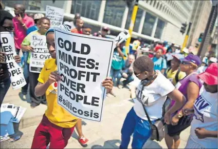  ?? Photo: Delwyn Verasamy ?? Sick and tired: Treatment Action Campaign and Sonke Gender Justice activists show their support for stricken gold miners outside the high court in Johannesbu­rg this week.