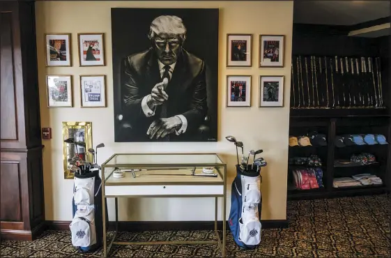  ?? SCOTT MCINTYRE — THE NEW YORK TIMES ?? The pro shop at Trump National Doral is decorated with images of former President Donald Trump. The focus of the former president’s hotel business is shifting from big cities to his golf resorts, which are benefiting from a relationsh­ip with the Saudi-funded LIV Golf tournament­s.