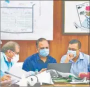  ?? HT PHOTO ?? Chief minister Kejriwal and Delhi health minister Satyendar Jain visited GTB hospital to review the ongoing work and video calling facility for Covid-19 patients and their family members.