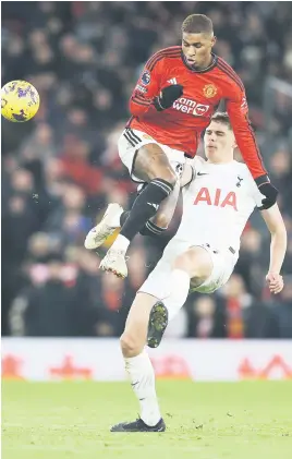  ?? Picture: Getty Images ?? TUSSLE. Manchester United’s Marcus Rashford is challenged by Spurs’ Micky van de Ven during their English Premier League match at Old Trafford last night.