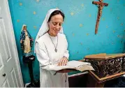  ??  ?? Sister Maria Faulkner reads a Bible in the chapel Gospel of Life Dwelling in south Oklahoma City.