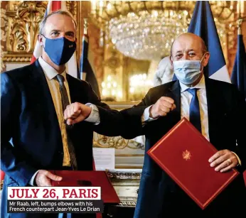  ??  ?? JULY 26, PARIS Mr Raab, left, bumps elbows with his French counterpar­t Jean-Yves Le Drian