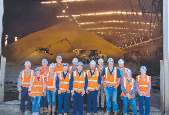  ?? ?? At the Townsville Sugar Terminal are (back from left) Serg Pagotto, Noel Mitchell, Simon Hood (Wilmar Grower Marketing and Pricing Solutions Manager), Anthony Contzonis, Jordan Mio and Trent Mio. Front from left: Lyn Mitchell, Annalea Matthews, Jarrod Dal Santo, Carter Dal Santo, Alex Dal Santo, Jimmy Hayllor, Caitlin Mio and Wilmar Burdekin Grower Marketing Consultant Yolanda Hansen.