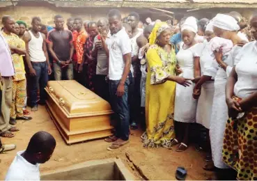  ?? PHOTO: ?? The remains of Hir Joseph, Daily Trust Bureau Chief in Jos, being prayed for before burial at his home town in Tyogbenda-Udende, Benue State yesterday Hope Abah